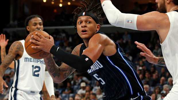 Orlando Magic’s Paolo Banchero holding the basketball